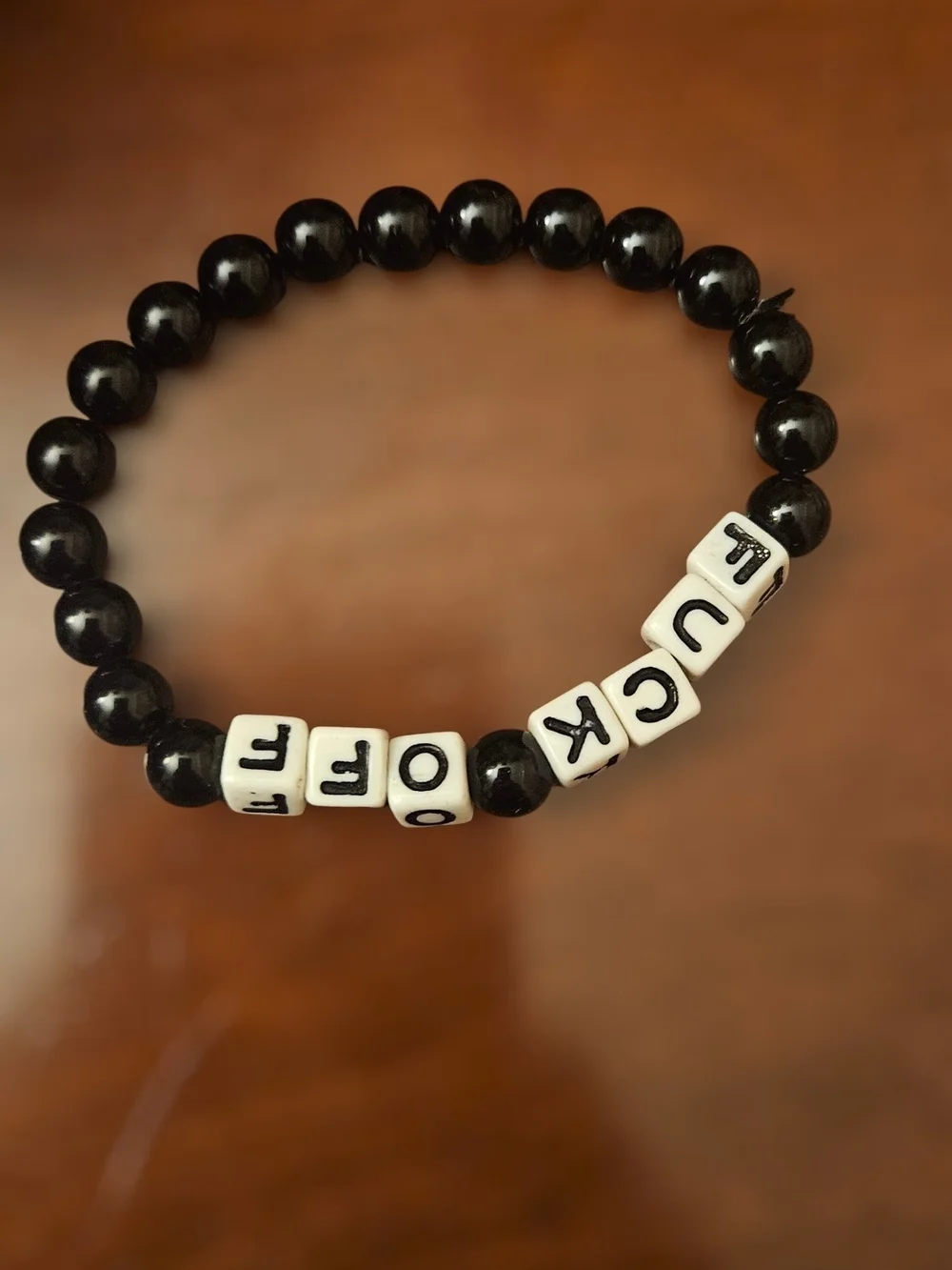 Spencer's Black Beaded Bracelet with White Letter Beads